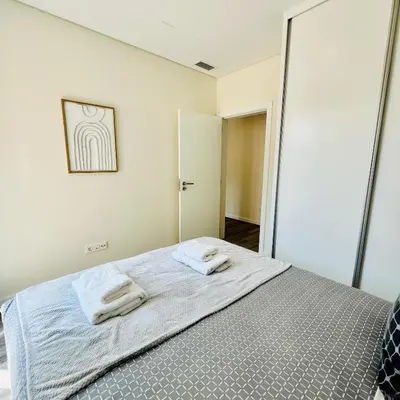 a bedroom with a bed with two towels on it at Carmo Heritage Terrace in Funchal