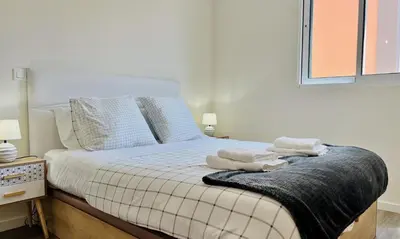 a bedroom with a bed with towels on it at Carmo Heritage Terrace in Funchal