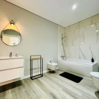 a bathroom with a tub and a sink and a toilet at Carmo Heritage Terrace in Funchal