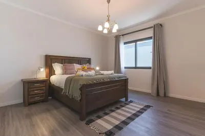 a bedroom with a bed and a window at Blue Outlook Garden by Atlantic Holiday in Água de Pena