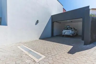 a car is parked inside of a garage at Blue Outlook Garden by Atlantic Holiday in Água de Pena