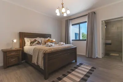 a bedroom with a large bed and a window at Blue Outlook Retreat by Atlantic Holiday in Água de Pena