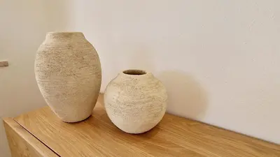 two vases sitting on top of a wooden table at Casa Contente 3-bedroom villa with pool in Luz