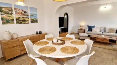 a living room with a white table and chairs at Casa Contente 3-bedroom villa with pool in Luz