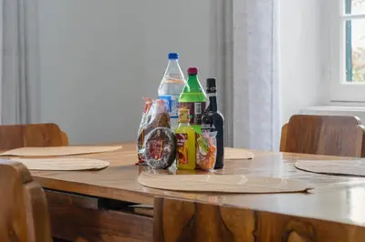 a table with bottles of alcohol on top of it at Akosuah's Villa in Funchal