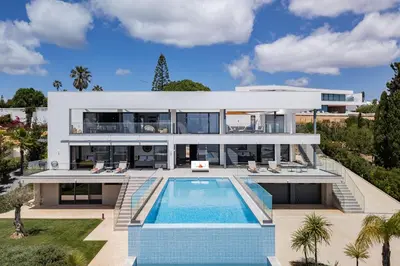 an aerial view of a house with a swimming pool at Villa Vanguard by Destination Algarve in Montinhos da Luz