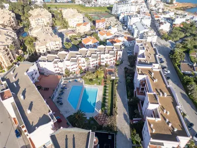 an aerial view of a city with houses and a swimming pool at St James 30 by Destination Algarve in Luz