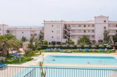a view from the balcony of a hotel with a swimming pool at St James 30 by Destination Algarve in Luz