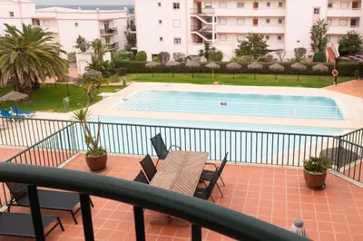 a balcony with a view of a swimming pool at St James 30 by Destination Algarve in Luz