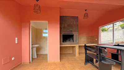 an orange room with a bench and a fireplace at Vila Rocha Do Sol 59B - Ensuite Room With Balcony View in Canhas