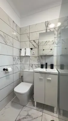 a white bathroom with a toilet and a sink at Vila Rocha Do Sol 59B - Ensuite Room With Balcony View in Canhas