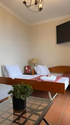 a town on a hill next to the ocean at Vila Rocha Do Sol 59B - Ensuite Room With Balcony View in Canhas
