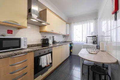 a kitchen with a counter top and a microwave at Atlantic View I By GALMI in Santa Cruz