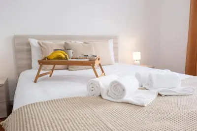 a bed with towels and a tray of bananas on it at Atlantic View I By GALMI in Santa Cruz