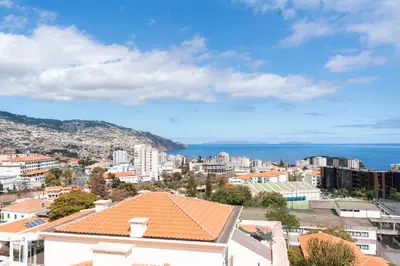 a view of the city from the roof of a building at Casa da Baía Overlooking Funchal Bay in Funchal
