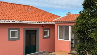 a red house with an orange roof at Vila Rocha Do Sol 59A - Ensuite Room With Balcony View in Canhas