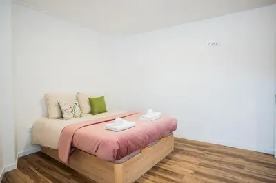 a bedroom with a bed with two towels on it at Madeira Melody in Funchal