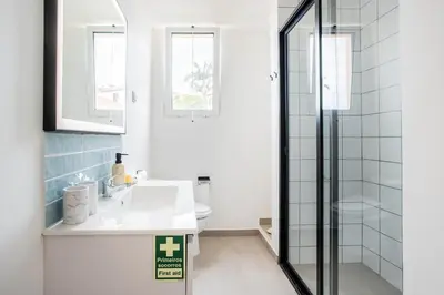 a bathroom with a sink and a shower at Madeira Melody in Funchal