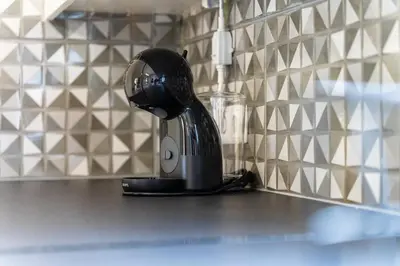 a coffee maker sitting on a counter in a kitchen at GuestReady – Charming Getaway by Madeira's Nature in Santana