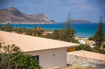 a house with a view of the ocean and mountains at Ohana - Casa de Praia by YOUR KEY in Porto Santo