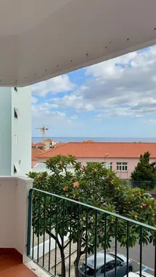 a balcony with a view of a building at Ohana Funchal in Funchal