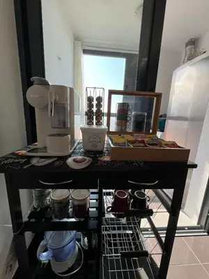 a table with a coffee maker on it in a kitchen at Heart of Madeira in Funchal