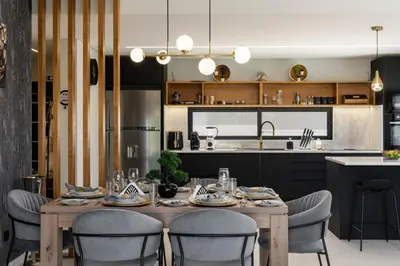 a kitchen and dining room with a table and chairs at Vila da Ponta do Pargo by An Island Apart in Ponta do Pargo