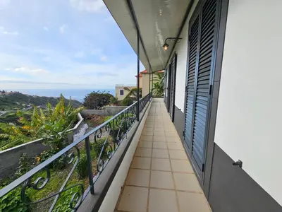 a balcony with a view of the ocean at Villa Rodrigues 2 by Rentallido in Campanário