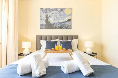 a bedroom with a bed with a tray of fruit on it at Senhora do Pilar by Atlantic Holiday in Santo António