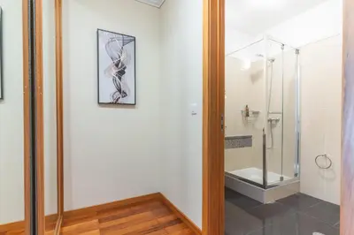 a bathroom with a shower with a glass door at Senhora do Pilar by Atlantic Holiday in Santo António