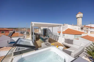 a balcony with a hot tub on a roof at Casa da Praça - Vila do Bispo, Algarve in Vila do Bispo
