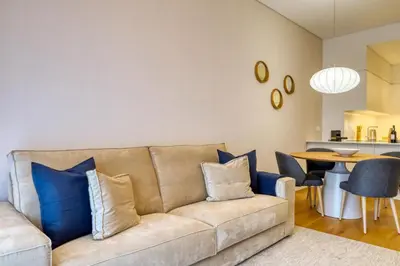 a living room with a couch and a table at Funchal Acqua Blue 3O, a Home in Madeira in Funchal