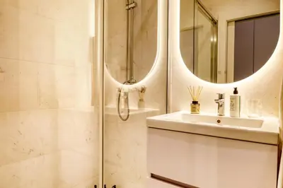 a bathroom with a shower and a sink and mirror at Funchal Acqua Blue 3O, a Home in Madeira in Funchal