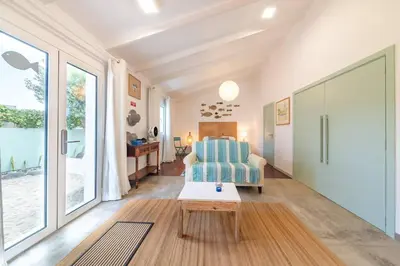a living room with a couch and a table at Casa Velha da Lagoa - Peixe by Mth in Ponta do Sol