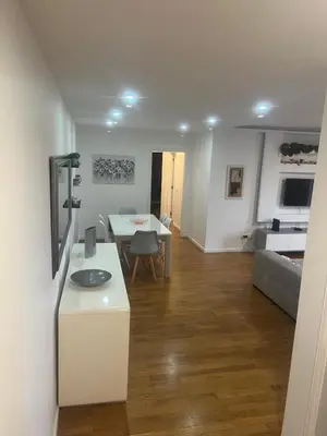 a kitchen and living room with a table and a couch at Relax accommodation in Funchal