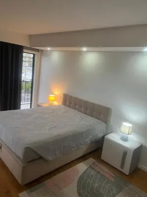 a bedroom with a large bed and a window at Relax accommodation in Funchal
