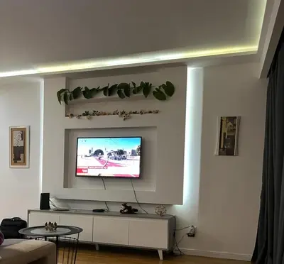 a living room with a flat screen tv on a wall at Relax accommodation in Funchal