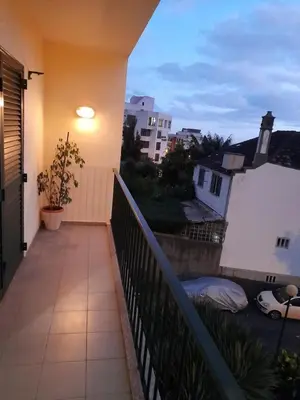 a balcony with a light on the side of a building at Relax accommodation in Funchal