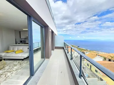 a balcony with a view of the ocean at Garajau Palace Sea View II by Rentallido in Caniço