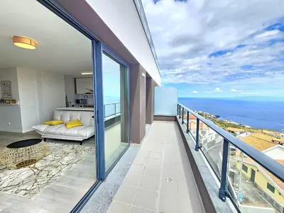 a balcony with a view of the ocean at Garajau Palace Sea View II by Rentallido in Caniço