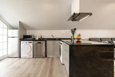a kitchen with white appliances and a counter top at Barreiro View in Ribeira Brava