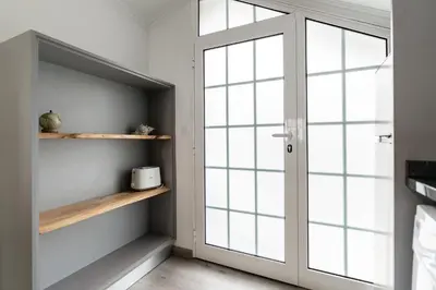 a room with a door and a window at Barreiro View in Ribeira Brava