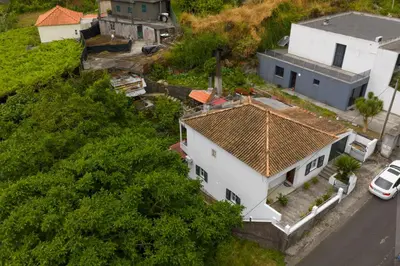 an aerial view of a white house with a roof at Casa Teixeira by Holiday Rental Madeira in Senhora do Rosário