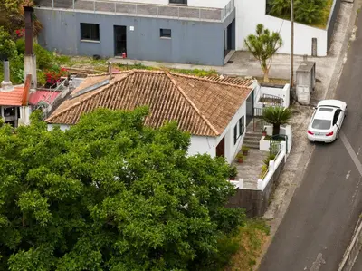 a white van parked in front of a house at Casa Teixeira by Holiday Rental Madeira in Senhora do Rosário