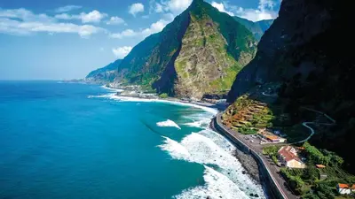 an aerial view of the ocean and a mountain at Casa Teixeira by Holiday Rental Madeira in Senhora do Rosário
