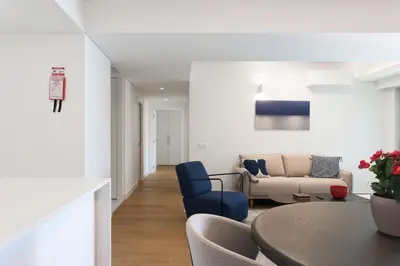 a kitchen and dining room with a table and chairs at Madeira Acqua Suite in Funchal