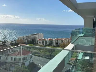 a view of the ocean from the balcony of a building at Oceanview Penthouse in Funchal in Funchal