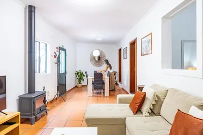 a living room with a couch and a stove at Pena Vista Mar Funchal by YOUR KEY in Funchal