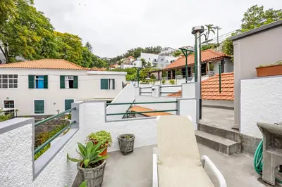 an apartment balcony with a view of a city at Pena Vista Mar Funchal by YOUR KEY in Funchal