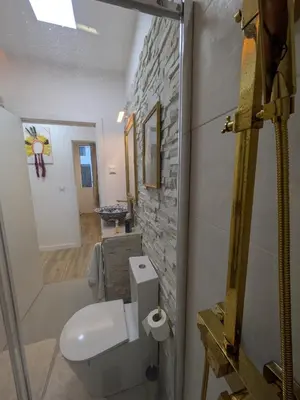 a hallway with a door open to a living room at Princess Flower in Funchal